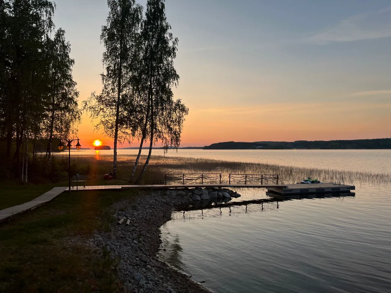 Sunset on Lake Kallavesi — birches and the dock